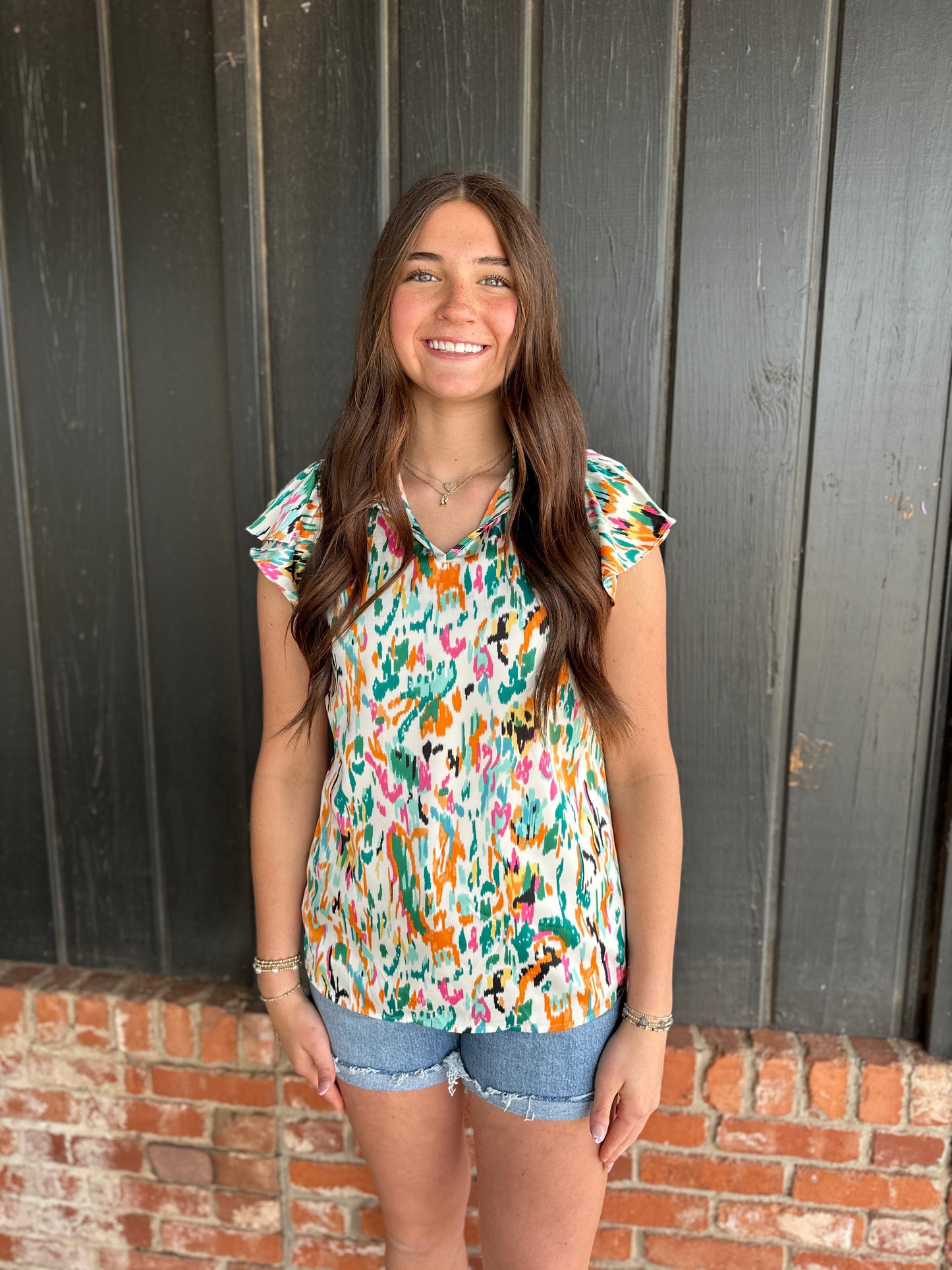 The Reni Print Flutter Sleeve Round Neck Casual Blouse