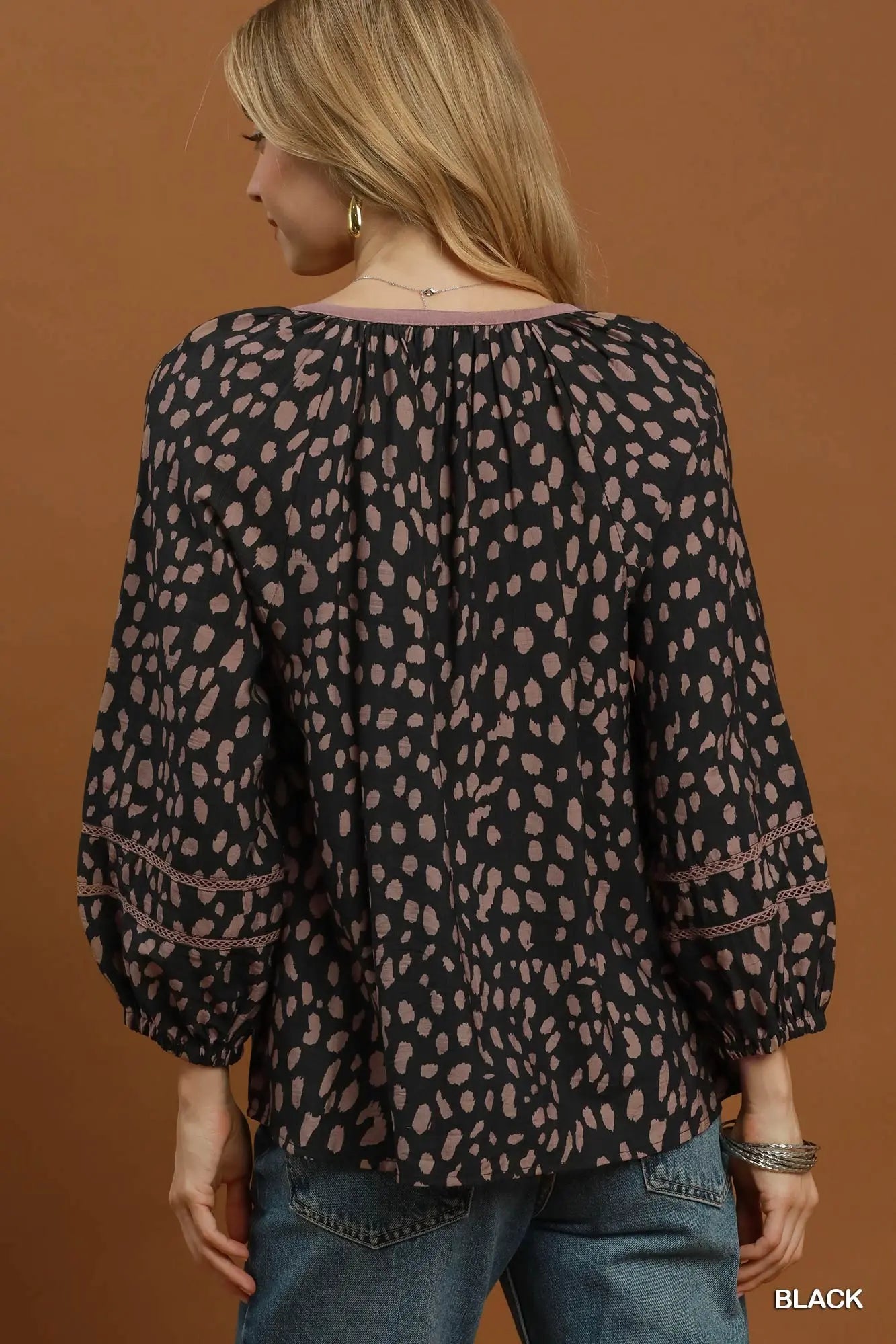 Black animal print tie neck top