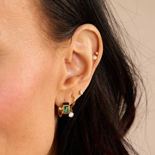 Green Baguette Bezel Huggies in Gold