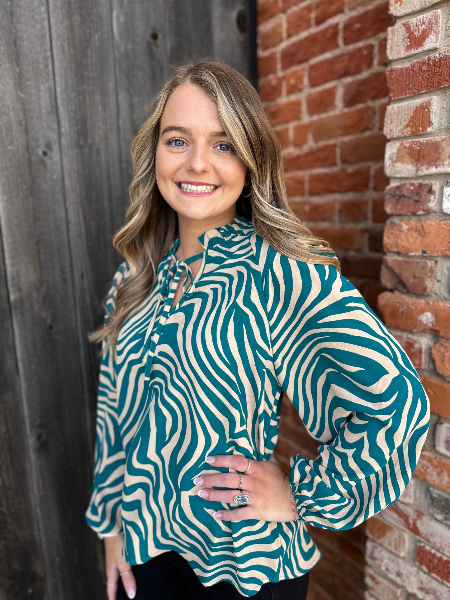 Teal and taupe print top
