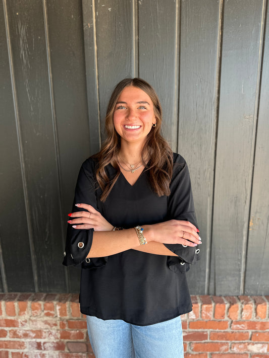Black three quarter sleeve top with eyelet detail