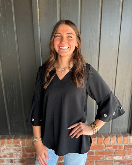 Black three quarter sleeve top with eyelet detail