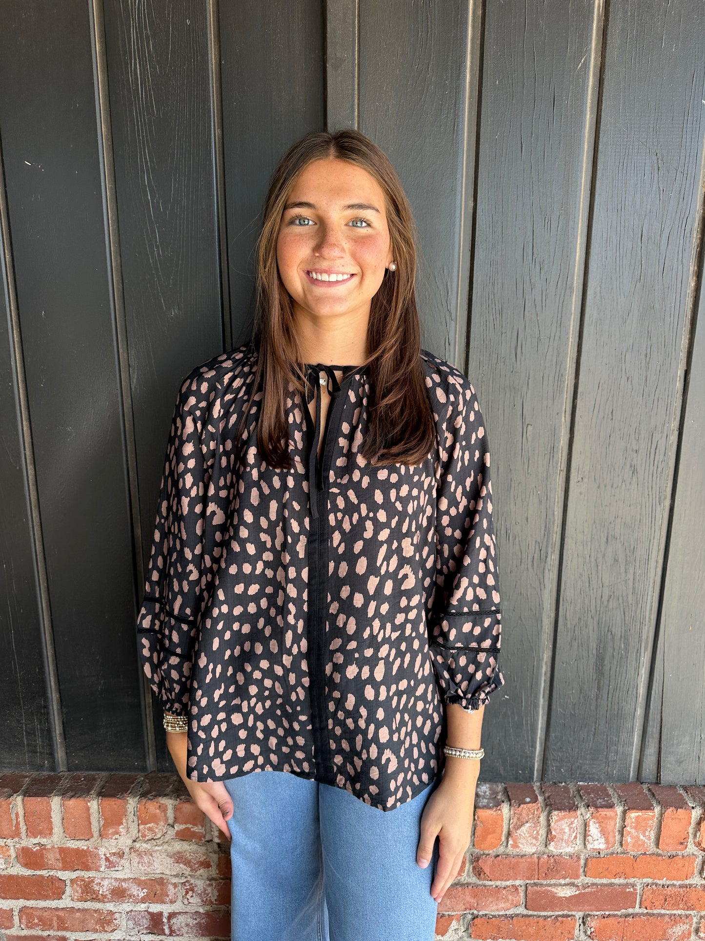 Black animal print tie neck top