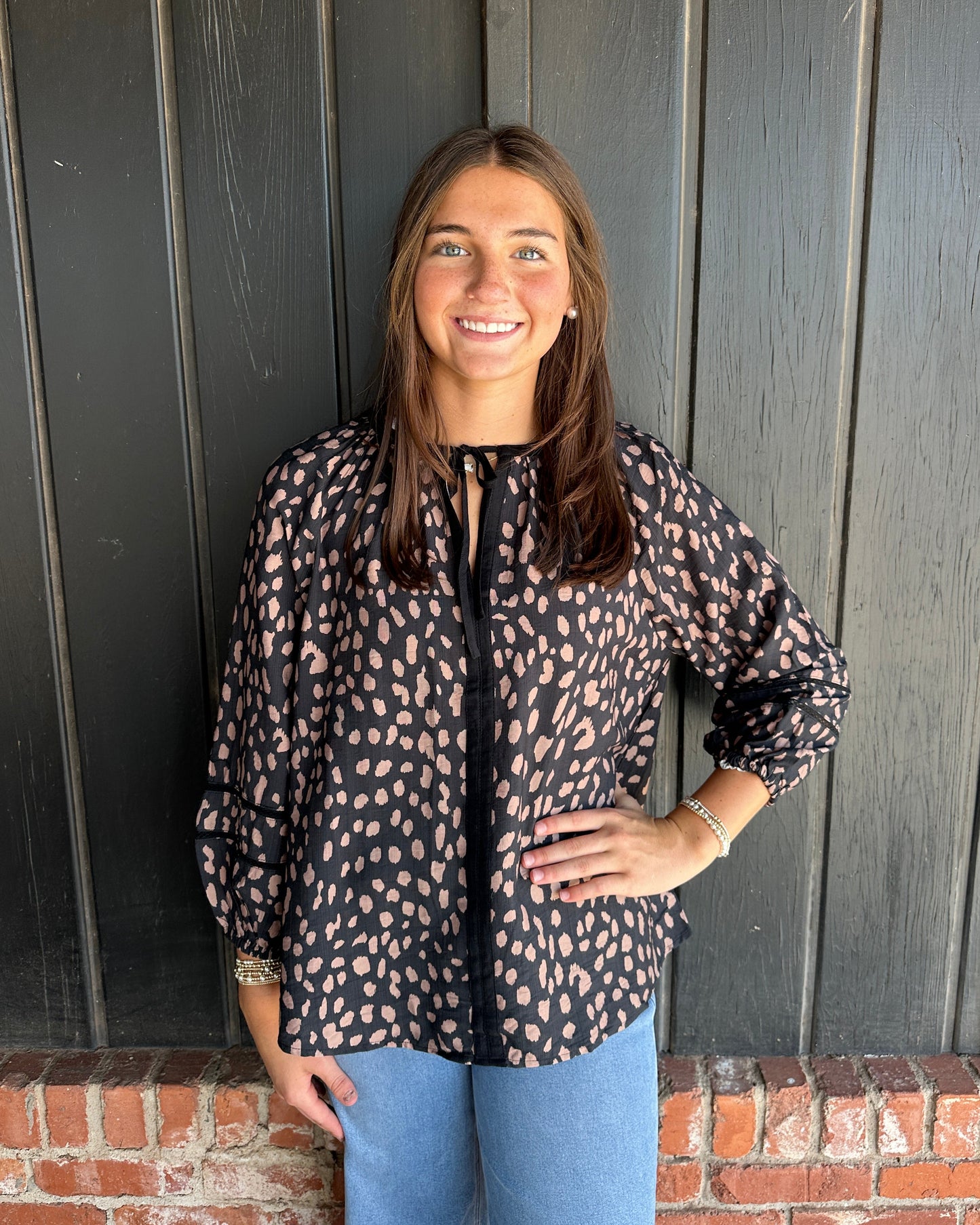 Black animal print tie neck top