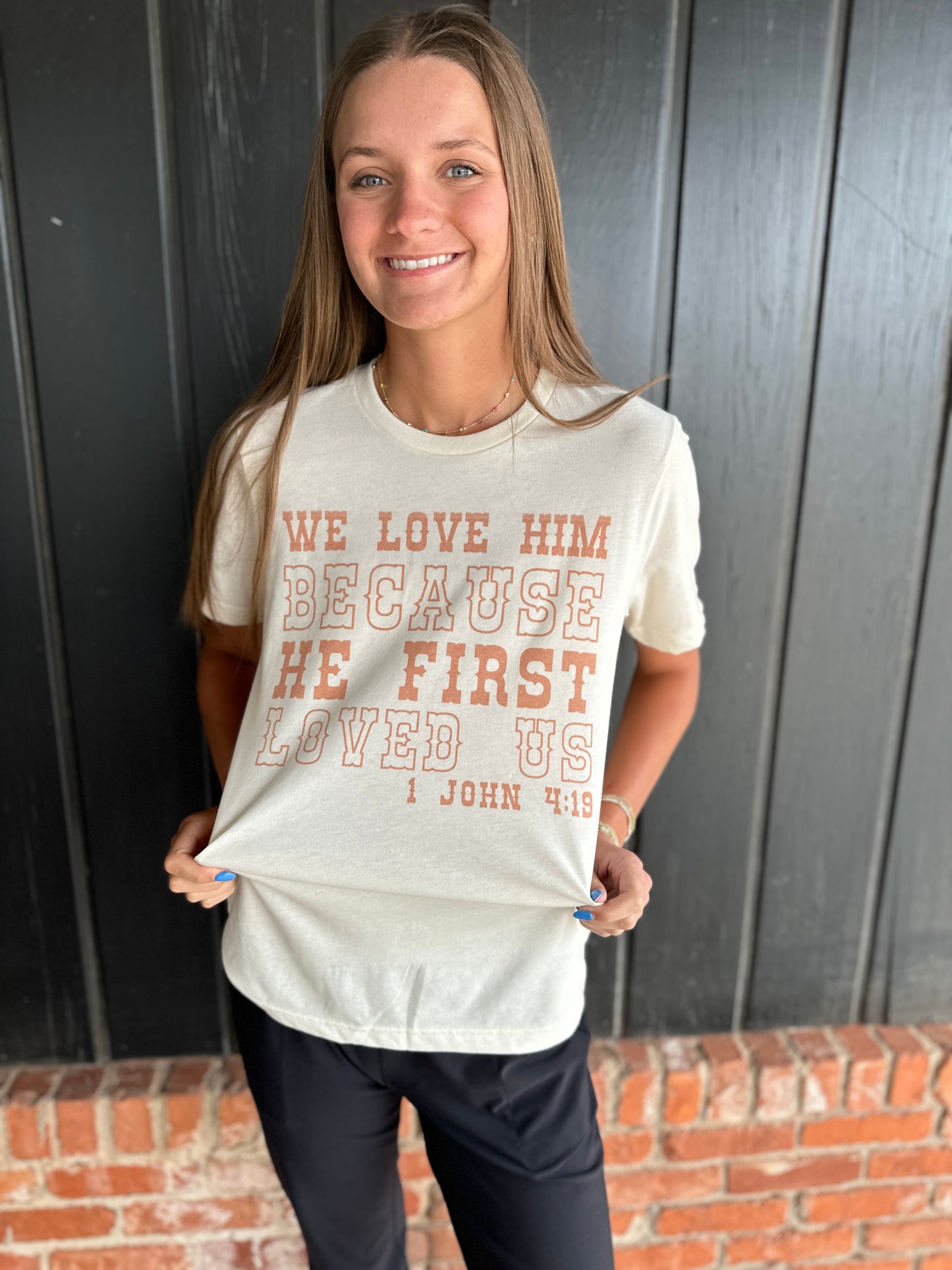 Love Him Because He First Loved Us Western Graphic Tee