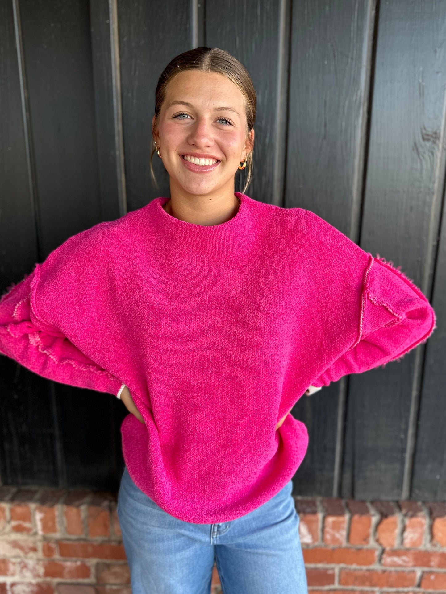 Bright Pink oversized mock neck raw hem sweater