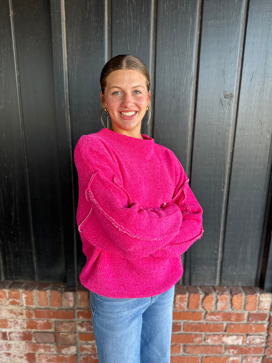 Bright Pink oversized mock neck raw hem sweater