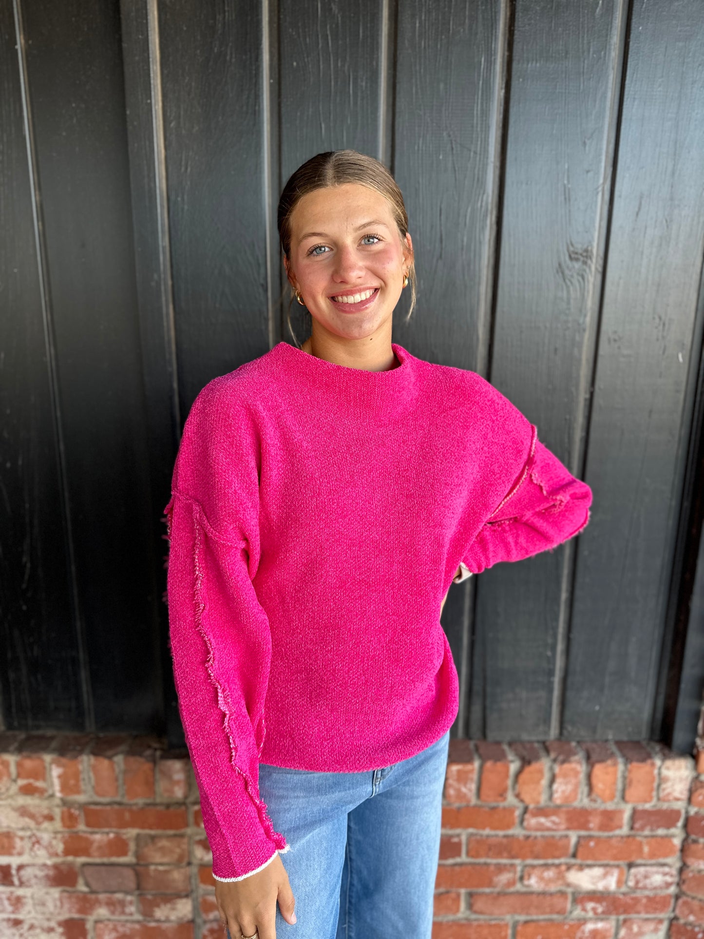 Bright Pink oversized mock neck raw hem sweater