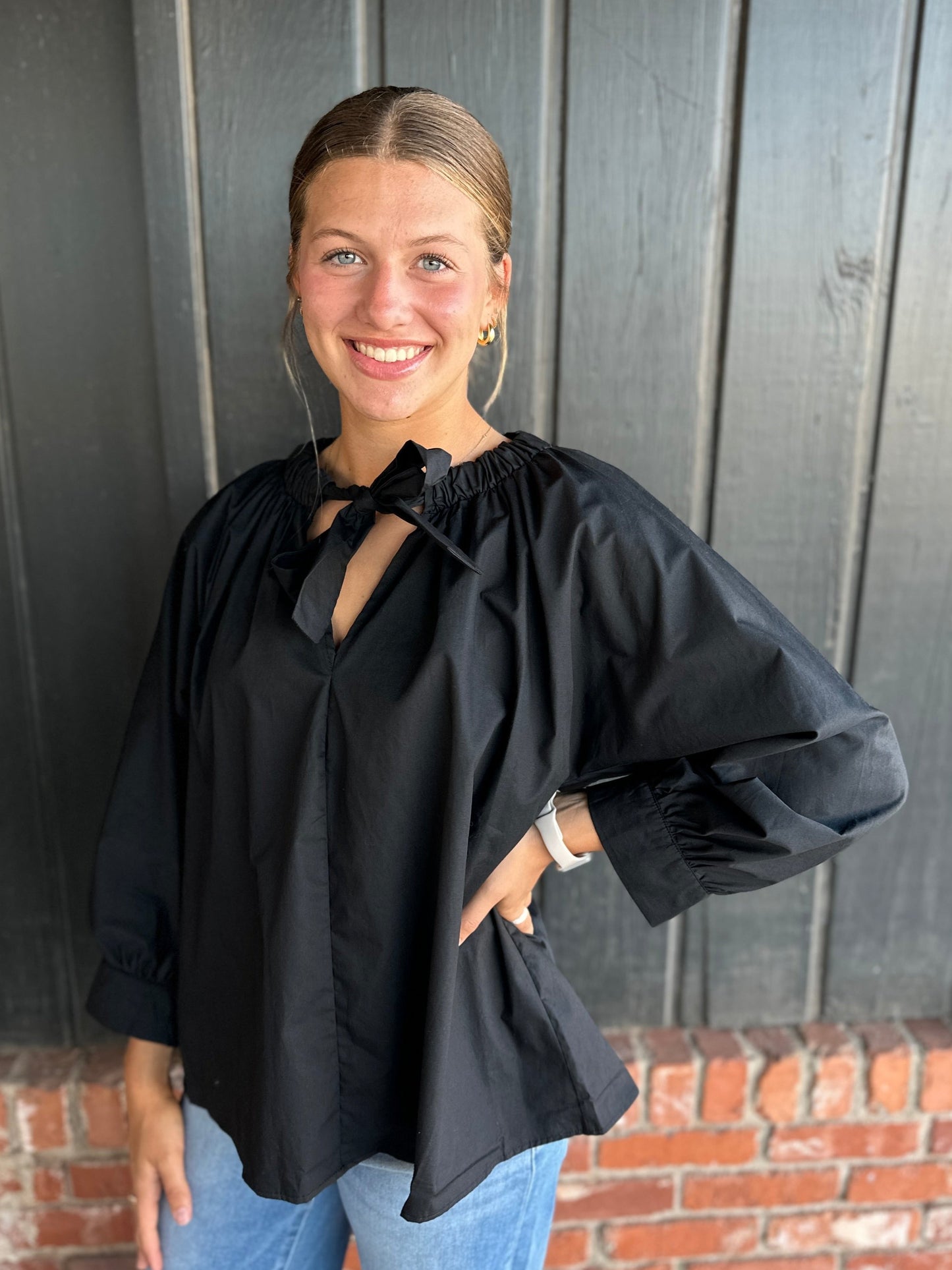 The Angie Black Poplin top with bow neckline