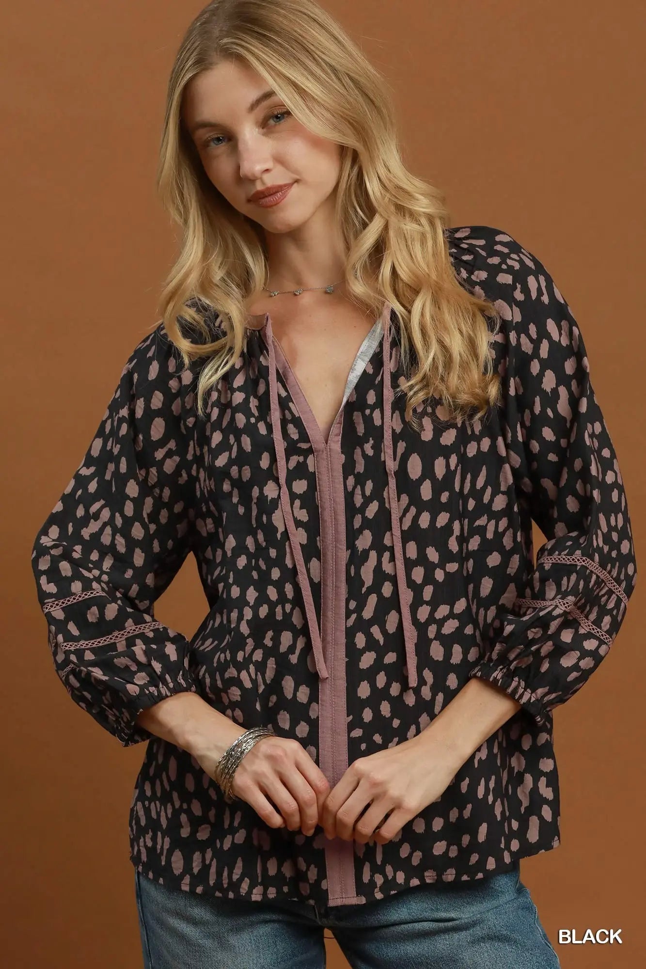 Black animal print tie neck top