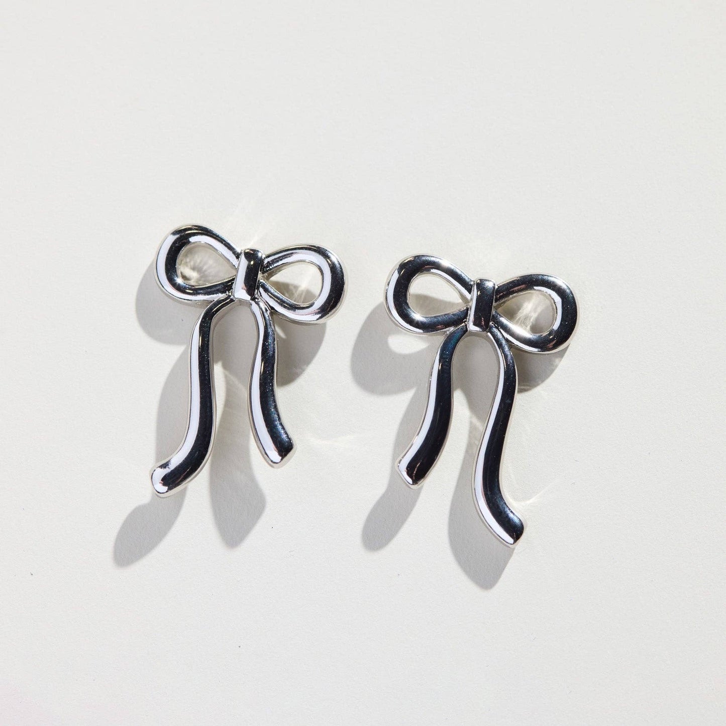 Silver Vintage Bow Studs Nickel & Suede