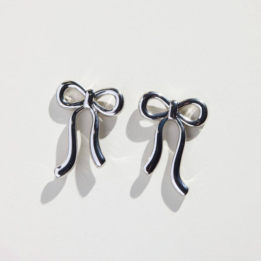Silver Vintage Bow Studs Nickel & Suede